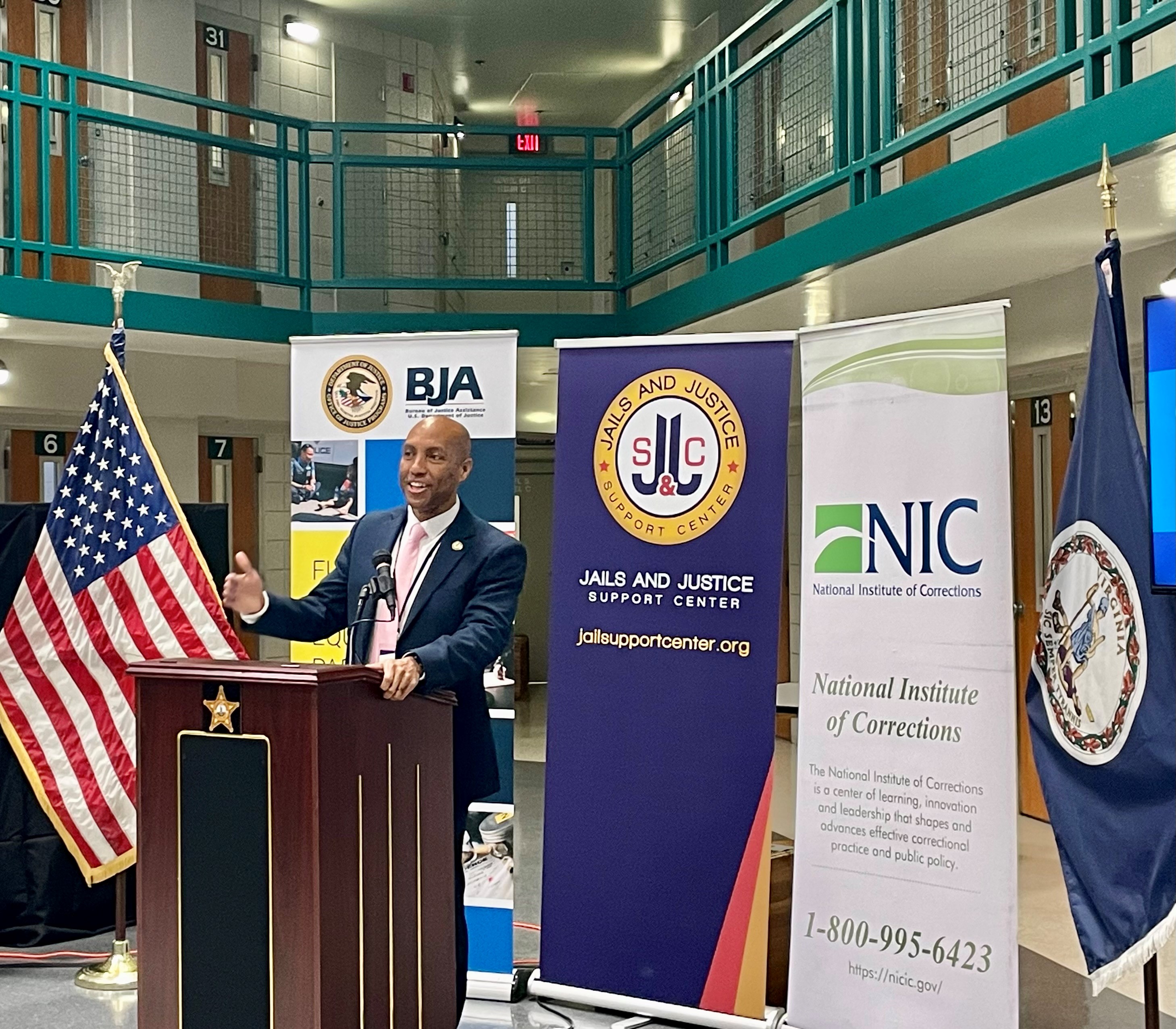 Director Karhlton F. Moore speaking at the Jails and Justice Support Center launch